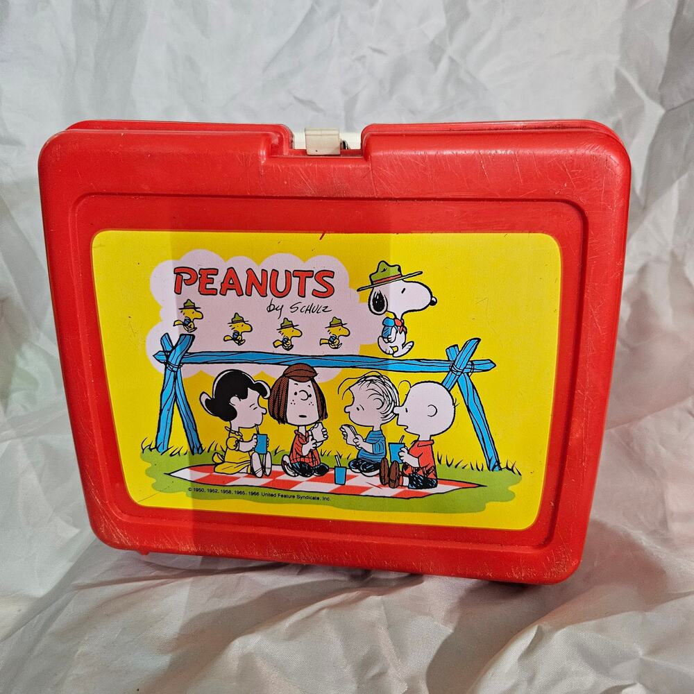 Charlie Brown and Snoopy Lunch Boxes on a Picnic blanket By Thermos.